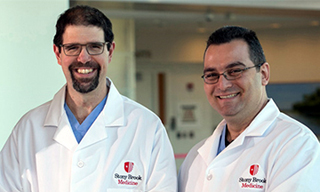 Dr. Aaron R. Sasson (l) and Dr. Georgioses V. Georgakis an image is here
